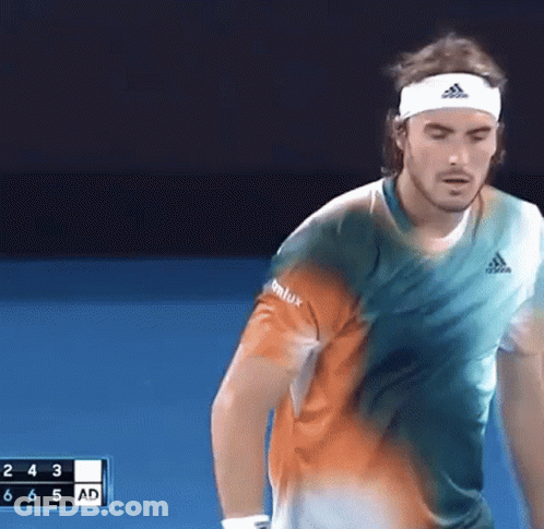 Man In Headband Playing Tennis On Blue Court GIF