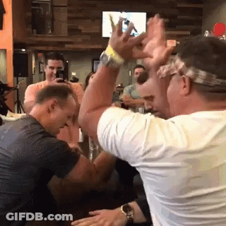 Man In Headband Raising Hands GIF
