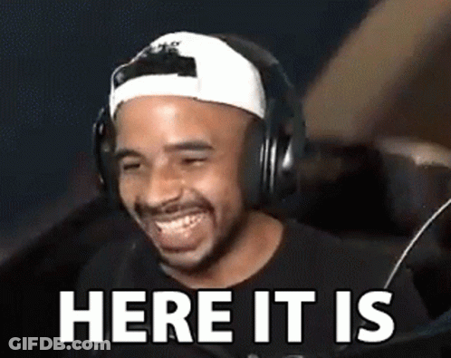 Man In Headphones And Baseball Cap Laughing Here It Is GIF