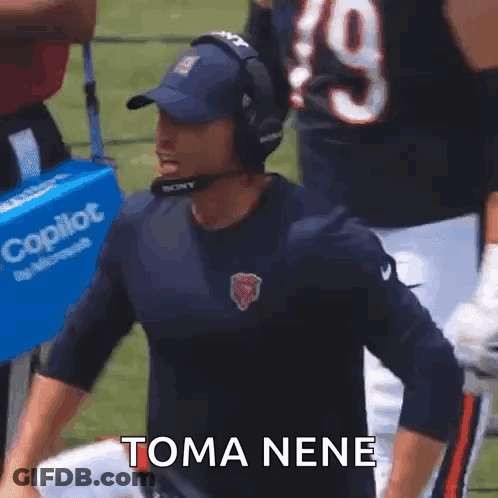Man In Headphones And Bear Shirt On Field GIF