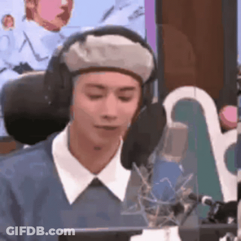 Man In Headphones And Beret Talking Into Microphone GIF
