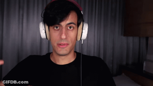 Man In Headphones And Black Shirt Looking At Camera GIF