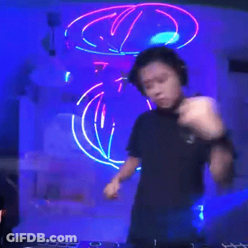 Man In Headphones And Black Shirt Playing DJ Set GIF