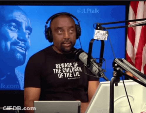Man In Headphones And Black Shirt Saying Beware Of The Children Of The Lie GIF
