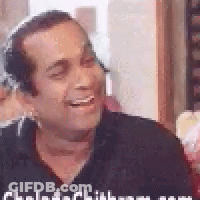 Man In Headphones And Black Shirt Smiling And Laughing GIF