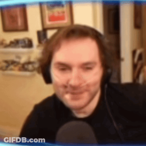 Man In Headphones And Black Shirt Smiling GIF