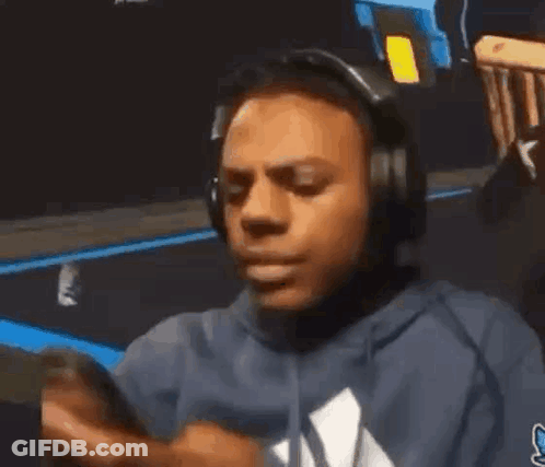 Man In Headphones And Blue Hoodie On Phone GIF