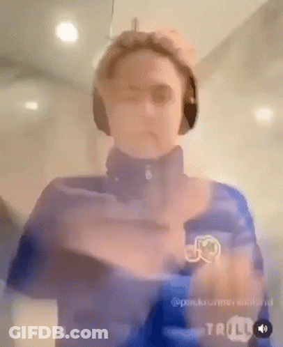 Man In Headphones And Blue Jacket Standing GIF