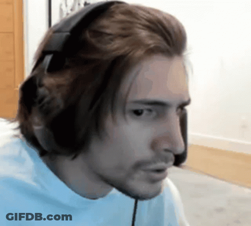 Man In Headphones And Blue Shirt At Computer GIF