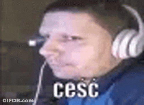 Man In Headphones And Blue Shirt At Computer GIF