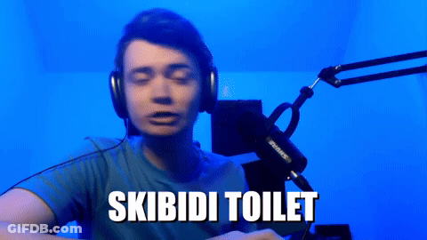 Man In Headphones And Blue Shirt Saying Skibidi Toilet GIF