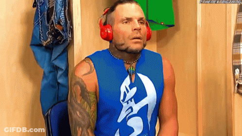 Man In Headphones And Blue Tank Top In Locker Room GIF