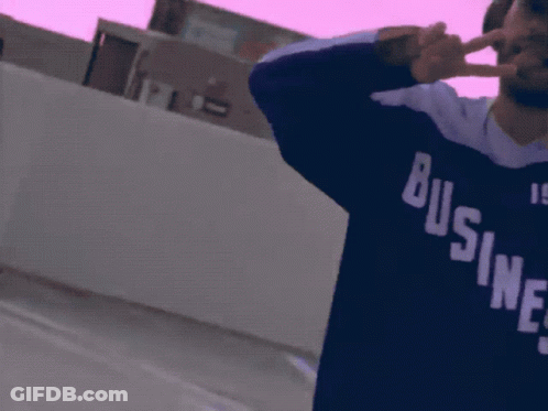 Man In Headphones And Business 1984 Shirt GIF