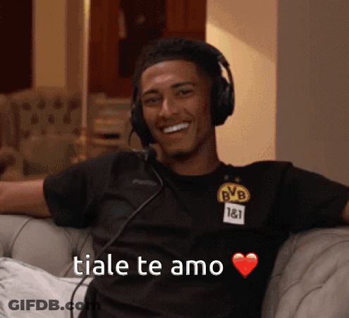 Man In Headphones And BVB Shirt Smiling On Couch GIF