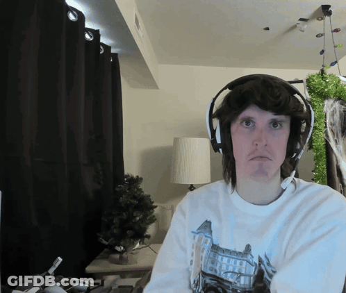 Man In Headphones And Castle Shirt GIF