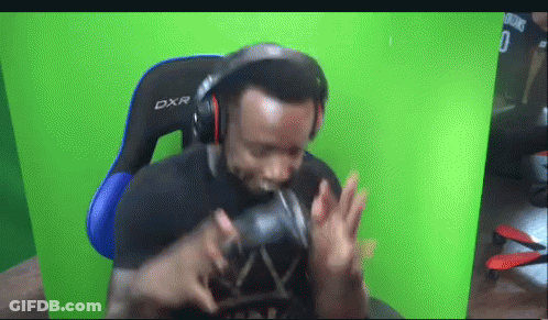 Man In Headphones And DXR Gaming Chair GIF