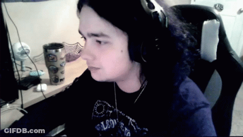 Man In Headphones And Falcons Shirt GIF