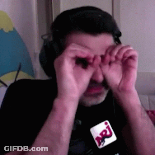 Man In Headphones And Glasses Covering Eyes GIF