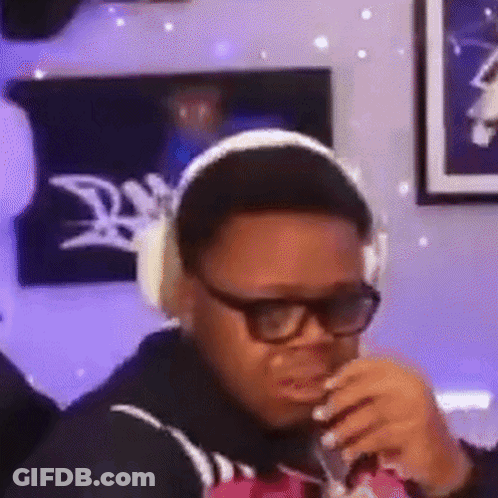 Man In Headphones And Glasses Drinking GIF
