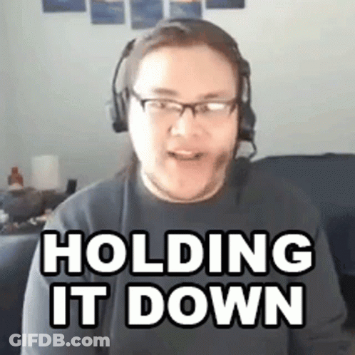 Man In Headphones And Glasses Holding It Down On Couch GIF