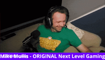 Man In Headphones And Green Shirt With Too Many Games GIF