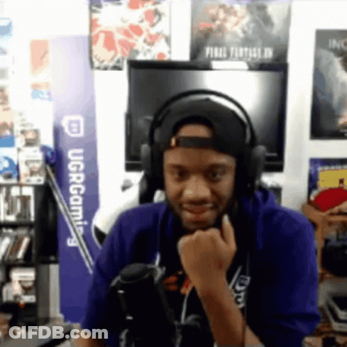 Man In Headphones And Hat At UCR Gaming Sign GIF