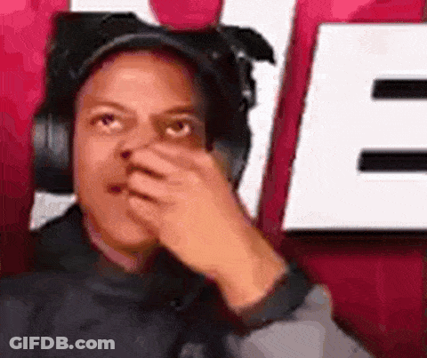 Man In Headphones And Hat Covering Nose GIF
