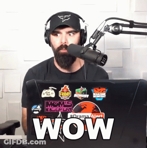 Man In Headphones And Hat In Front Of Microphone And Laptop Says Wow GIF
