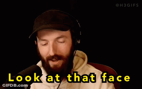 Man In Headphones And Hat Looking At Camera GIF