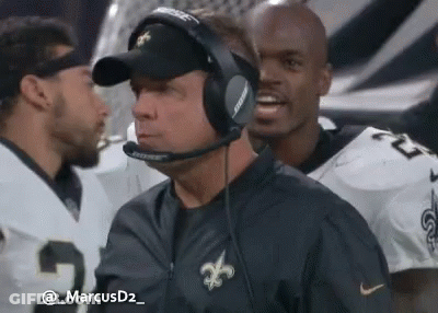 Man In Headphones And Hat With Football Players GIF