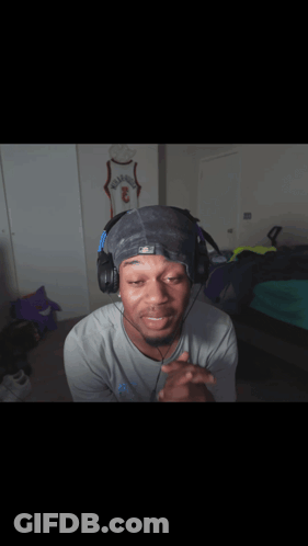 Man In Headphones And Hat With Number 3 GIF