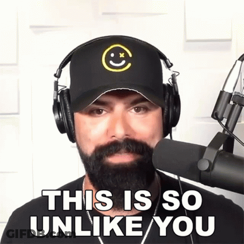 Man In Headphones And Hat With Smiley Says This Is So Unlike You GIF