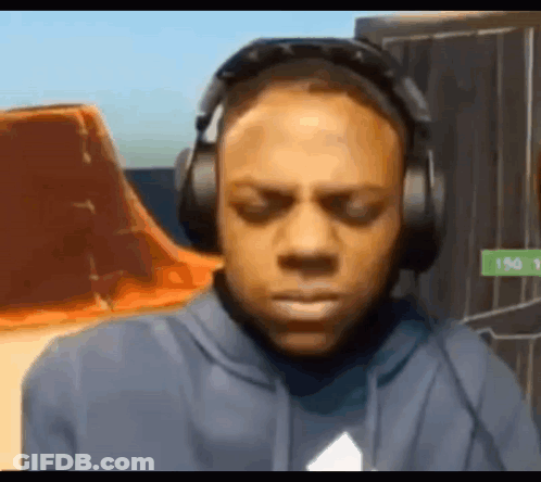Man In Headphones And Hoodie Looking At Camera GIF