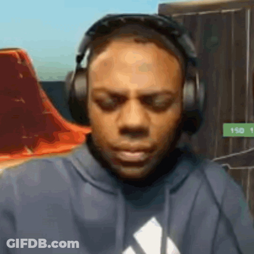 Man In Headphones And Hoodie Looking Down GIF