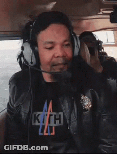 Man In Headphones And Kith T-Shirt GIF
