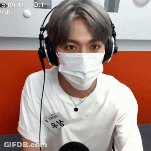 Man In Headphones And Mask With Name Tag B Taul GIF