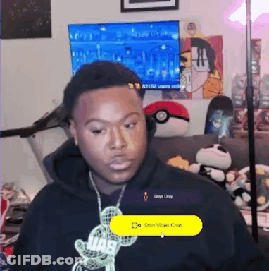 Man In Headphones And Mickey Mouse Necklace On Couch GIF