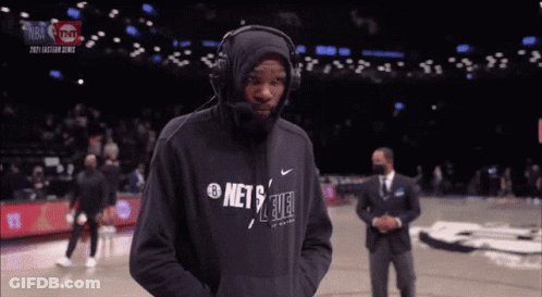 Man In Headphones And Nets Sweatshirt GIF