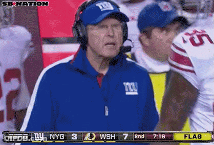 Man In Headphones And NY Giants Jacket Watching ESPN Football GIF