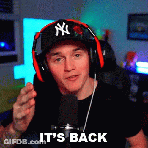 Man In Headphones And NY Hat Saying It's Back GIF