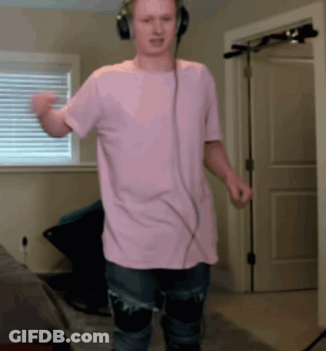 Man In Headphones And Pink Shirt GIF