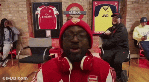 Man In Headphones And Red Arsenal Jacket GIF