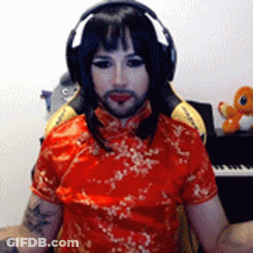 Man In Headphones And Red Dress At Piano GIF