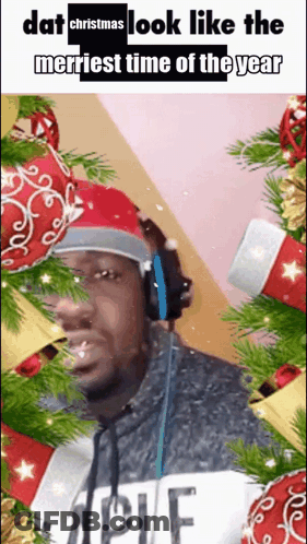 Man In Headphones And Santa Hat Saying Dat Christmas Look Like The Merriest Time Of The Year GIF