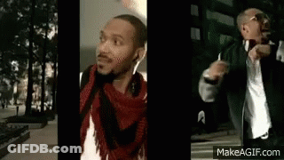 Man In Headphones And Scarf On Sidewalk GIF