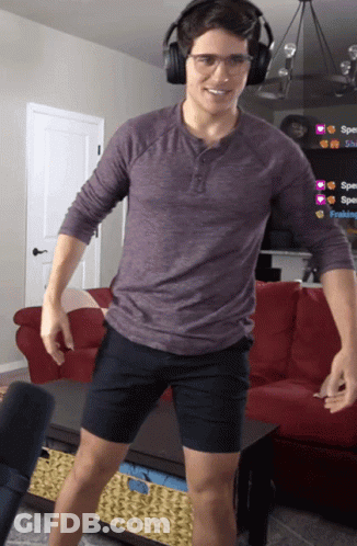 Man In Headphones And Shorts By Couch GIF