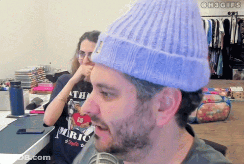 Man In Headphones And Sunglasses Wearing King Gizzard Shirt GIF