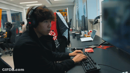 Man In Headphones And Supreme Shirt Typing GIF