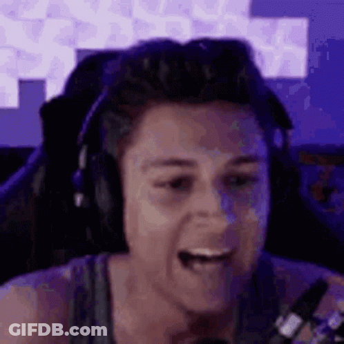 Man In Headphones And Tank Top At Microphone GIF