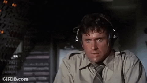 Man In Headphones And Tie In Airplane Cockpit GIF